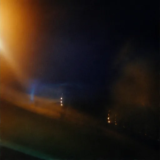 Orange flare in a dark accidental night frame