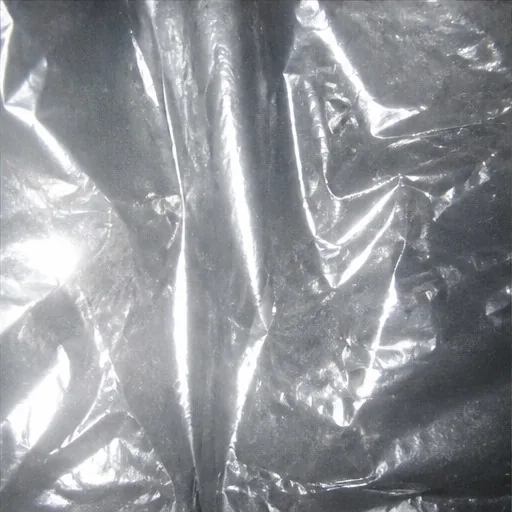 Silver plastic reflecting a direct flash