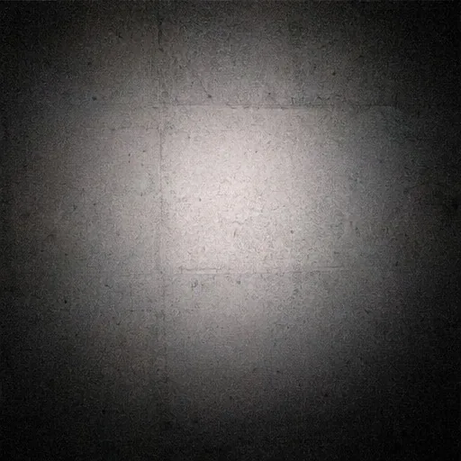 Flash mark spreading across a dark wall
